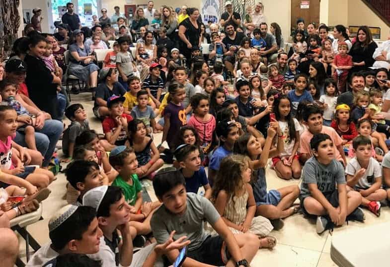 Sephardic Jewish children and families gathered for a community celebration.