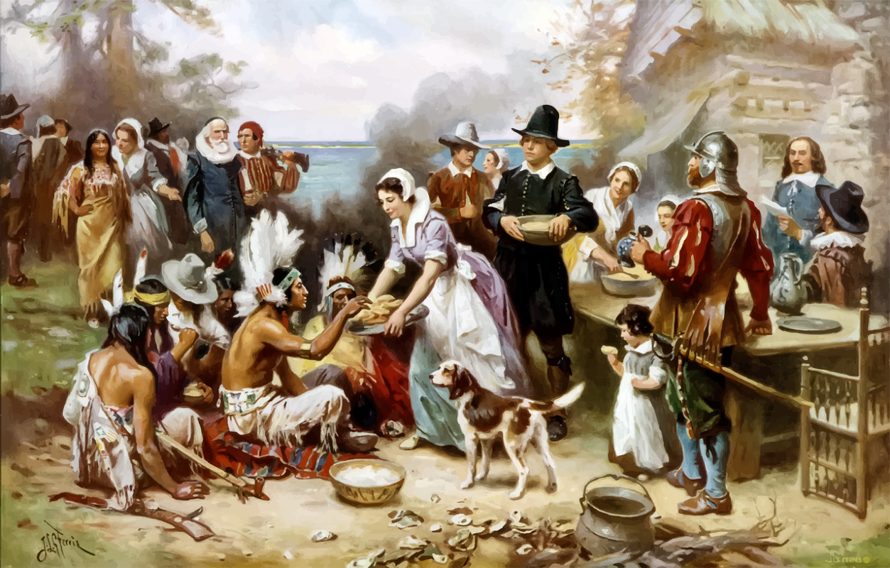 image of indians and pilgrams sharing Thanksgiving meal