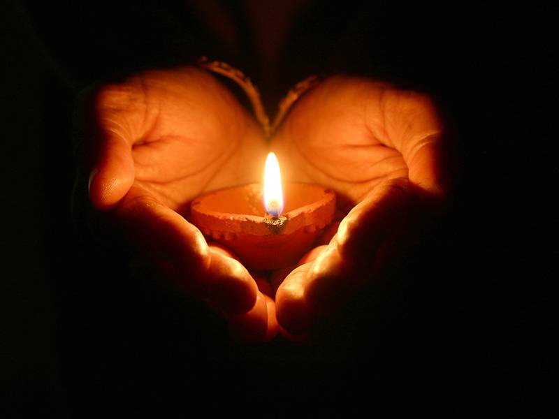 azkara in loving memory candle hands