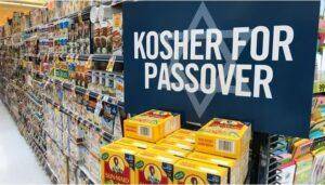Supermarket Passover shopping section with 'Kosher for Passover' sign and Sun-Maid raisins, featuring Sephardic-specific approved grocery items and brand recommendations.
