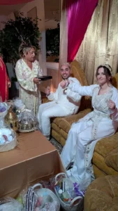 A moroccan sephardic bride and groom and groom's mother prepare the henna