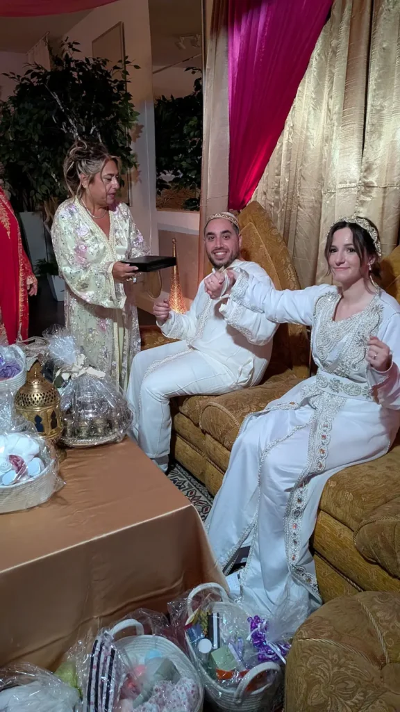 A moroccan sephardic bride and groom and groom's mother prepare the henna