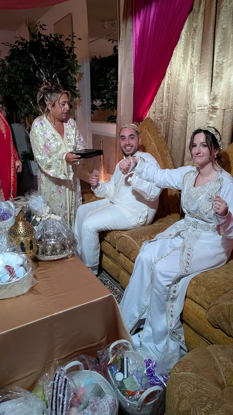 A moroccan sephardic bride and groom and groom's mother prepare the henna