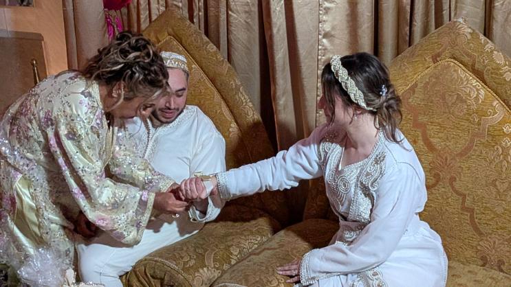 Groom's mother applying henna to the new Moroccan Sephardic bride
