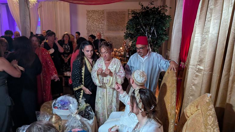 Family of the bride and groom and friends exchanging gifts