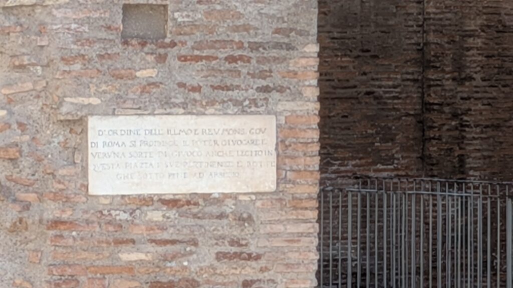 This is a marble plaque located at the Portico d'Ottavia in Rome Italy